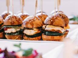 A tray of vegan burgers neatly presented on a tray