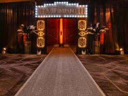 A VIP Entrance for GOTO Creates Night at the Oscars. A glittery carpet leads towards this.