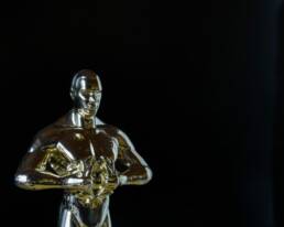 An Oscar statue close up on a black background for GOTO Creates - Night at the Oscars.