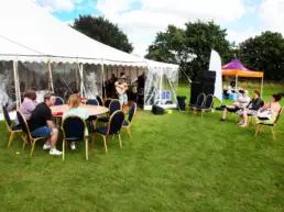 people watching live performer at corporate event