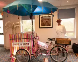 Pick and mix colourful cart and bike at western corporate event